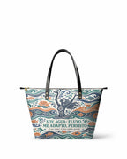 "Soy agua fluyo, me adapto, persisto" ver.1 Leather Tote Bag - front view | Paleta Bags