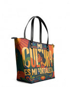 "Mi cultura es mi fortaleza" ver.2 Leather Tote Bag - side view | Paleta Bags