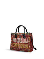 "Mi cultura es mi fortaleza" ver.6 Leather Handbag - side view | Paleta Bags