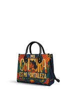 "Mi cultura es mi fortaleza" ver.2 Leather Handbag - side view | Paleta Bags