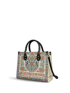 "Mi cultura es mi poder" ver.3 Leather Handbag - side view | Paleta Bags