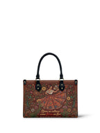 "Nacida de la tierra, hecha para el mundo" ver.5 Small Leather Handbag - front view | Paleta Bags