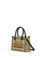 "Educada. Orgullosa. Imparable" ver.4 Small Leather Handbag - side view | Paleta Bags